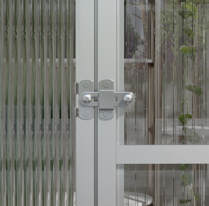 Close-up of the locking system on the greenhouse with a latch, blurred background