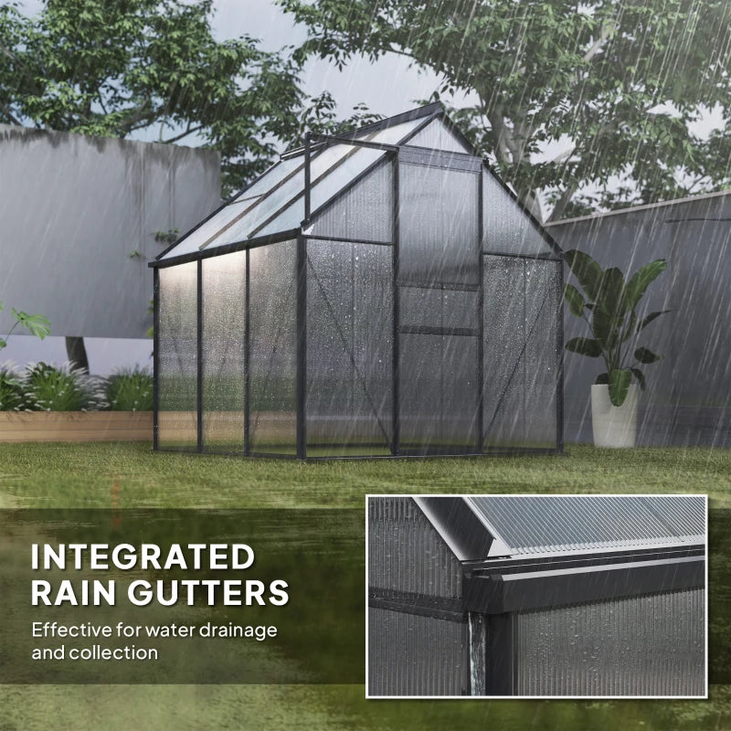 Greenhouse with integrated rain gutters during rain, showing water drainage system.