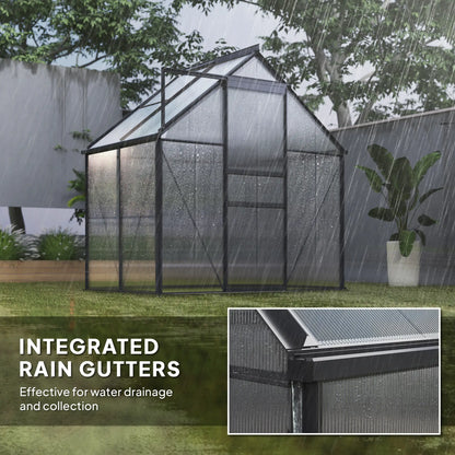 Greenhouse with integrated rain gutters during rain, showing water drainage system.