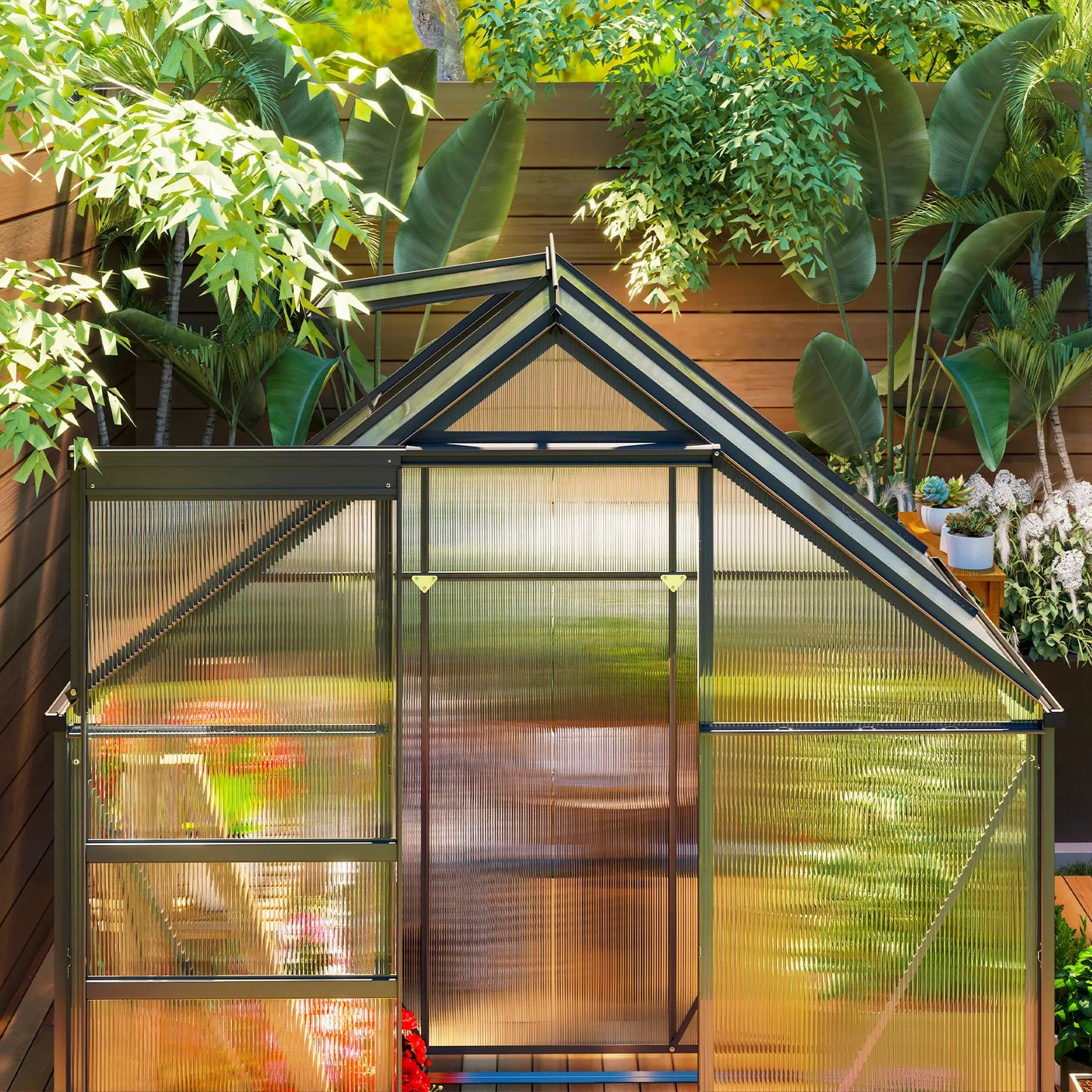 Small greenhouse with plants and garden furniture in a backyard setting