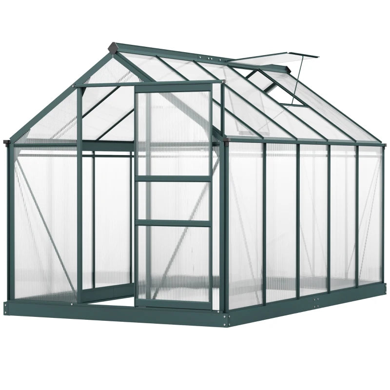 Green metal greenhouse with transparent panels on a white background
