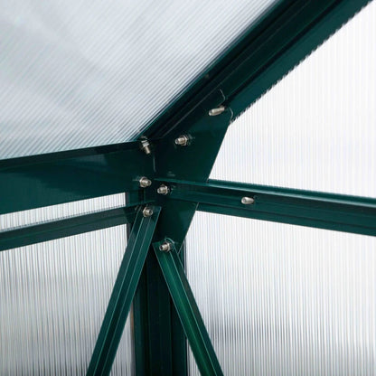 Close-up of a green metal frame with screws against a white background