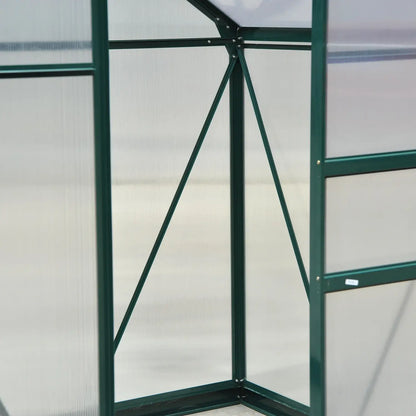 Green metal frame of a greenhouse with transparent panels