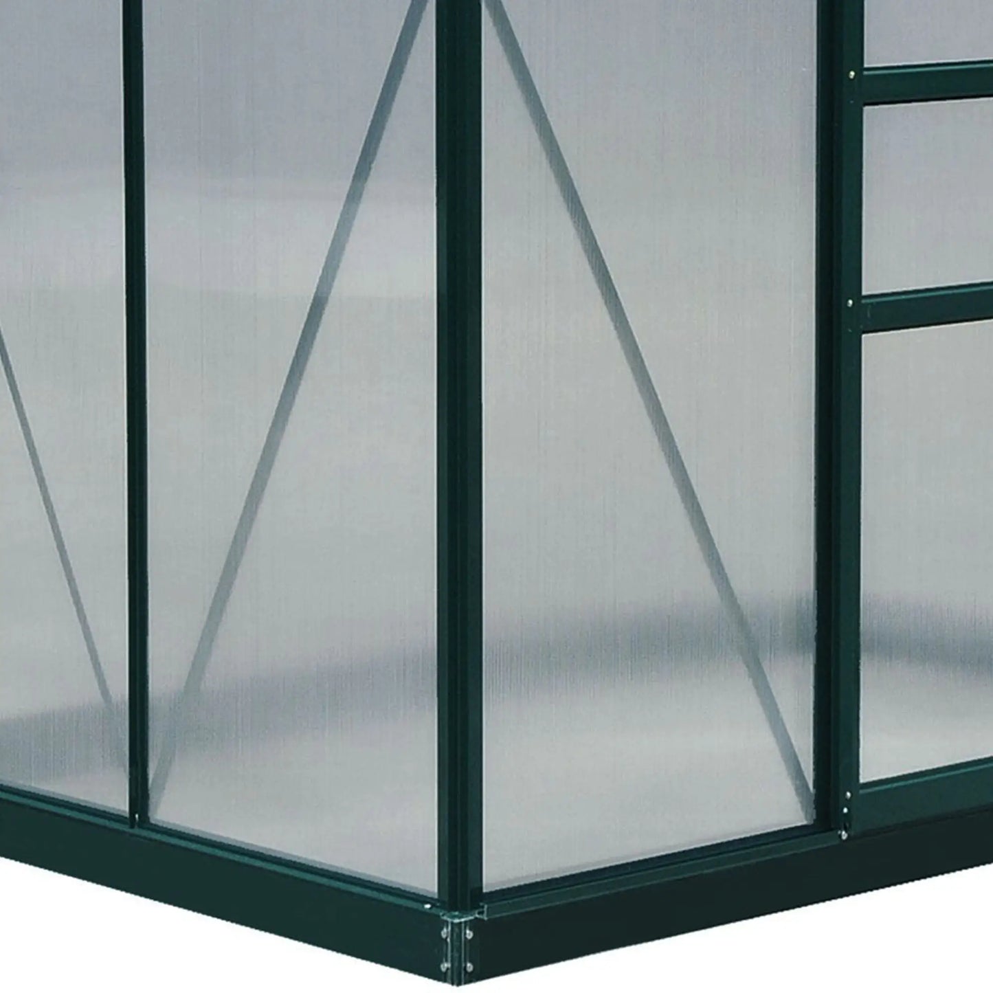 Corner of a greenhouse with transparent panels and green metal frame