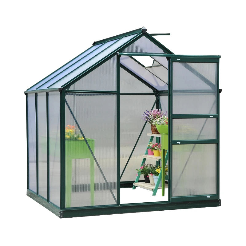 Greenhouse with transparent walls and a green frame, containing plants and gardening tools.