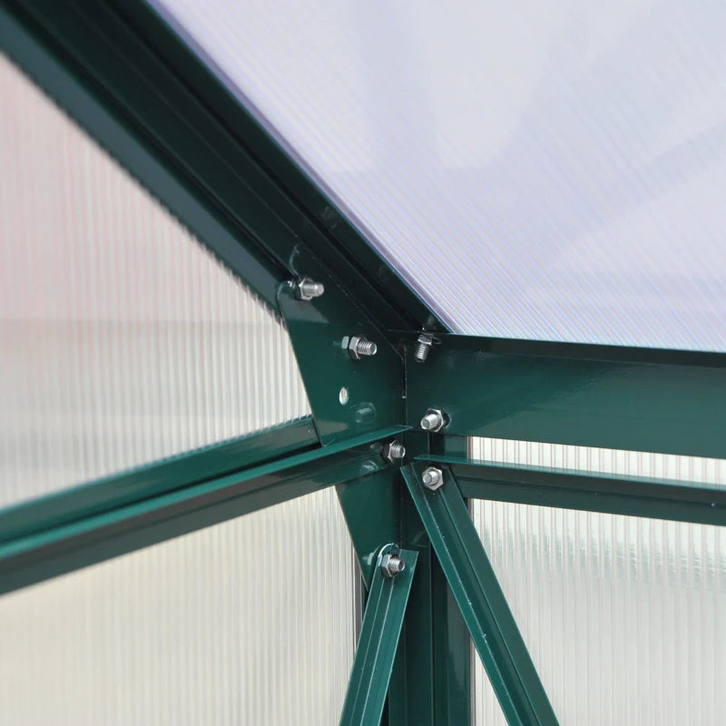 Close-up of a green metal frame with screws against a light background