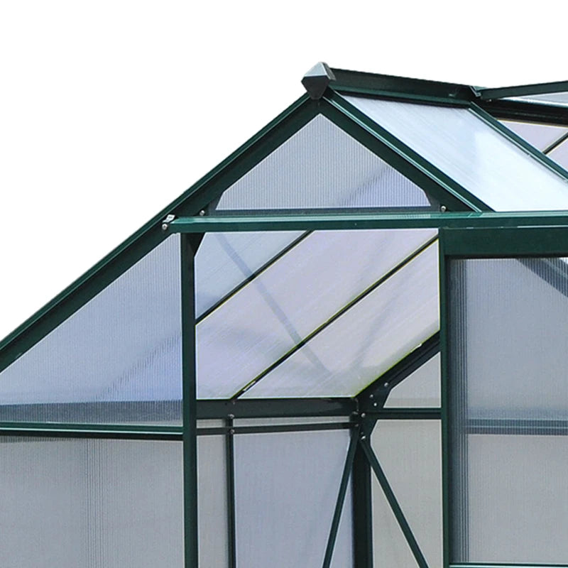 Greenhouse structure with glass panels and metal frame on a white background