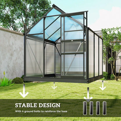 Glass greenhouse with stable design feature highlighted on a grassy area with trees in the background.