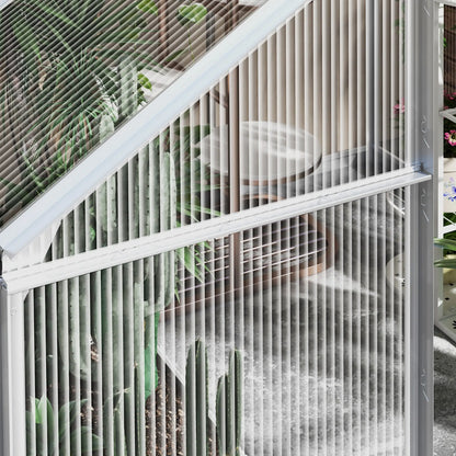 Metallic grid structure with plants and a chair in the background