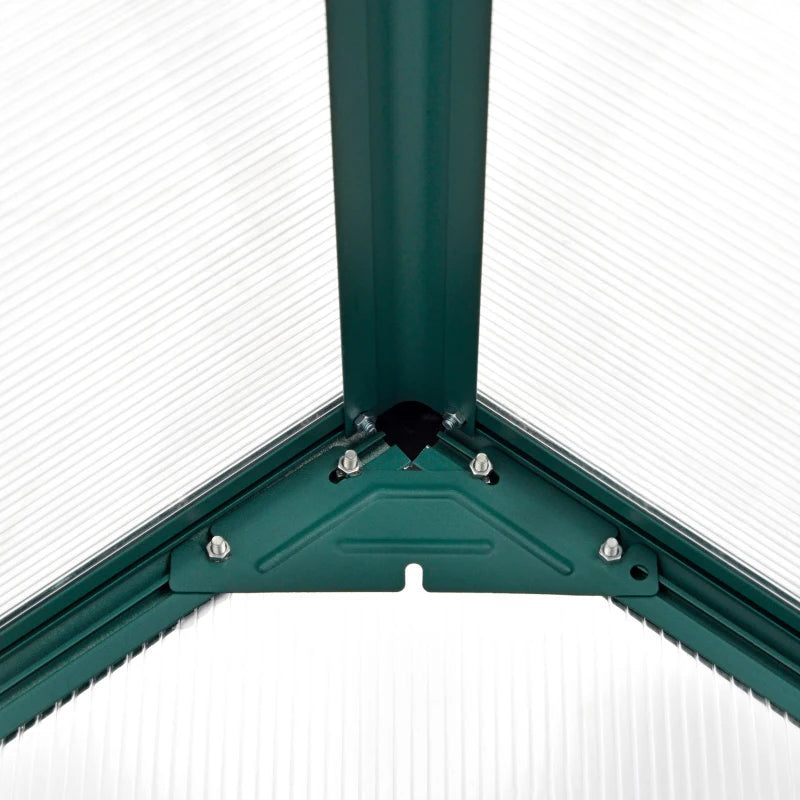 Close-up of a green metal frame corner with screws on a white background