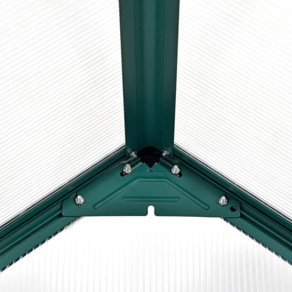 Close-up of a green metal frame corner with screws on a white background