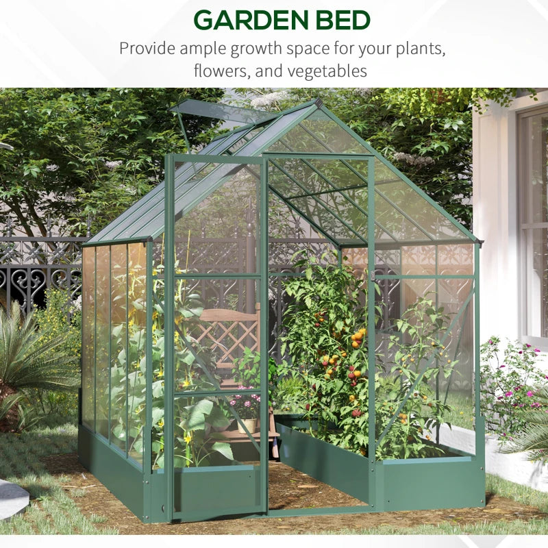 Green garden bed with glass panels in a garden setting
