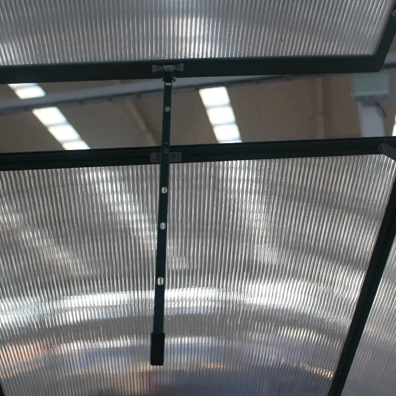 Metal screen with a black frame on a reflective surface
