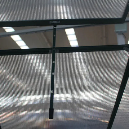 Metal screen with a black frame on a reflective surface