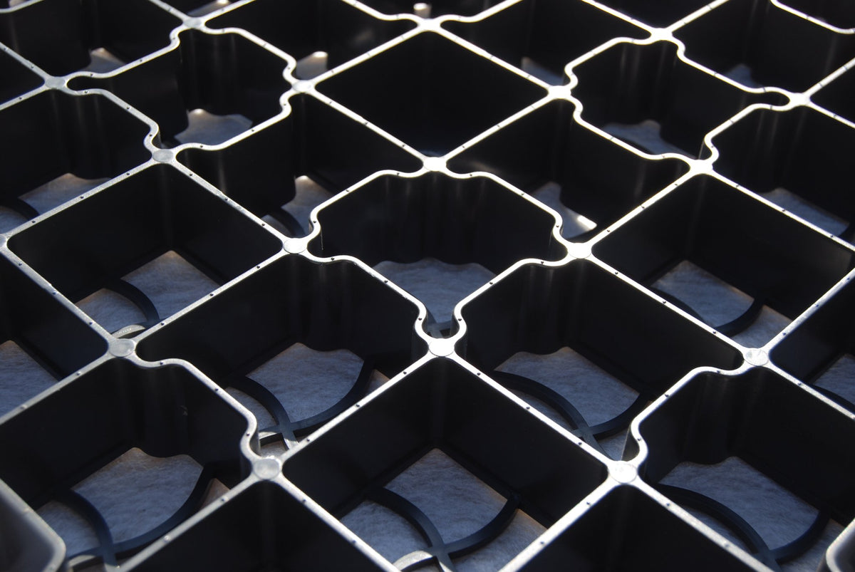 EcoBase Fastfit Shed Base Kit showing a sturdy plastic base with grid pattern for easy installation and support.